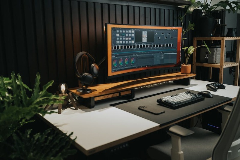 An ultrawide monitor setup with multiple code windows open, demonstrating productivity.