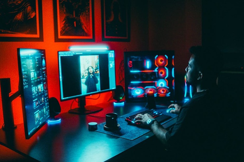 A complete developer gaming setup featuring a high-end monitor, keyboard, and mouse.